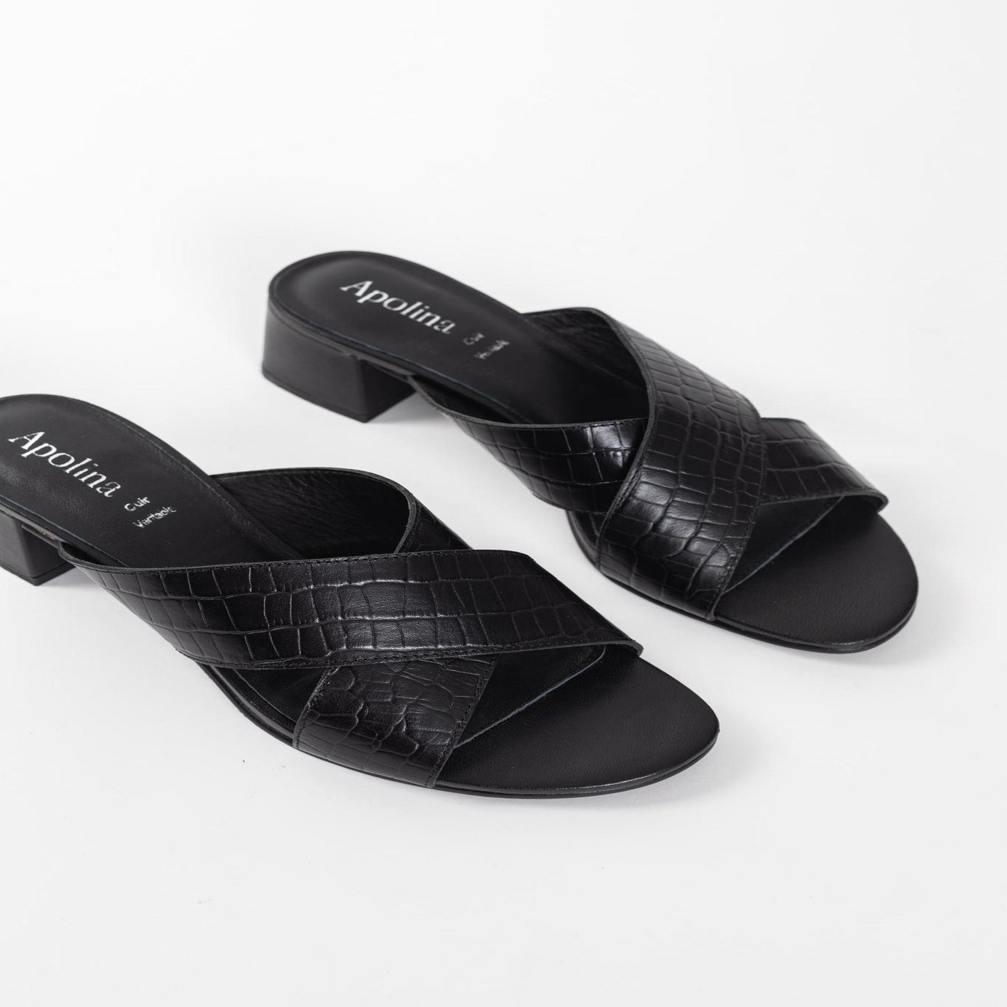 BAUDI mules à talon en cuir noir